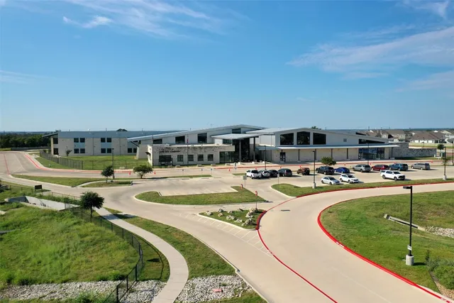 an aerial view of a house with outdoor space