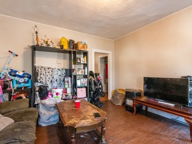 a living room with lots of furniture and a flat screen tv
