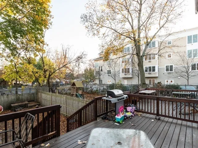 a view of a house with wooden fence