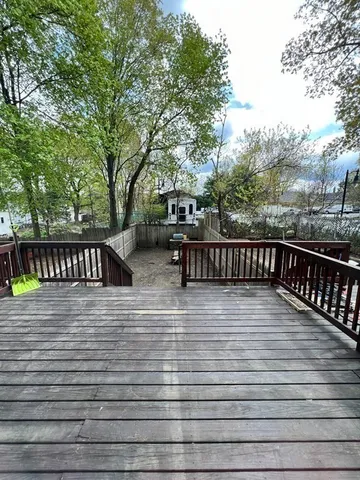 a view of wooden deck with patio