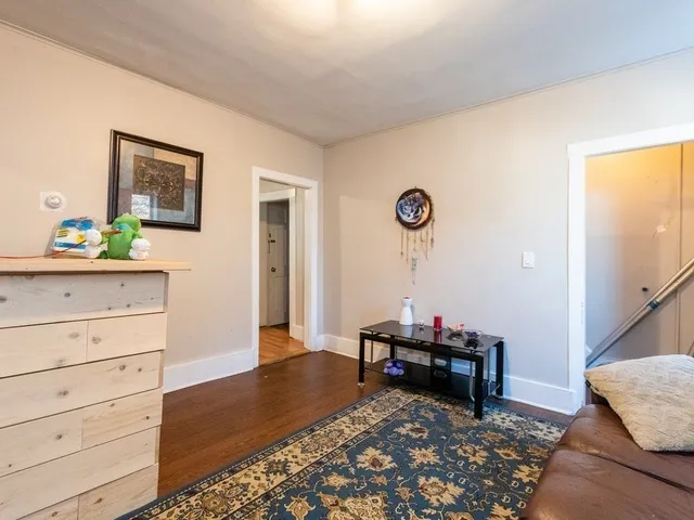 a room with furniture and a wooden floor