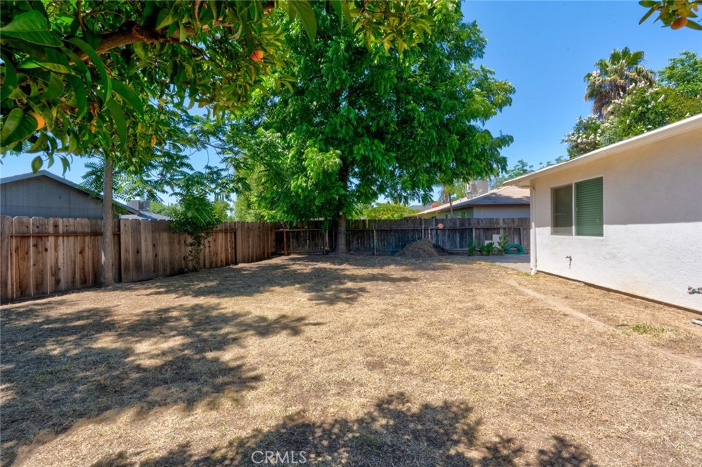 1840 Cheyenne Drive Merced, CA 95348 - Photo 79 of 90 a backyard of a house with a small yard and wooden fence