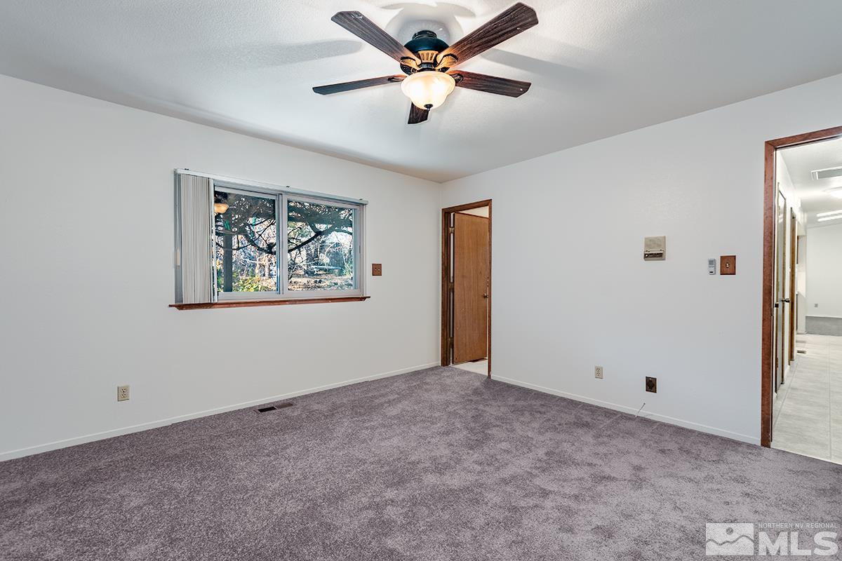 11040 Broken Hill Road Reno, NV 89511 - Photo 16 of 24 a view of a big room with closet and ceiling fan