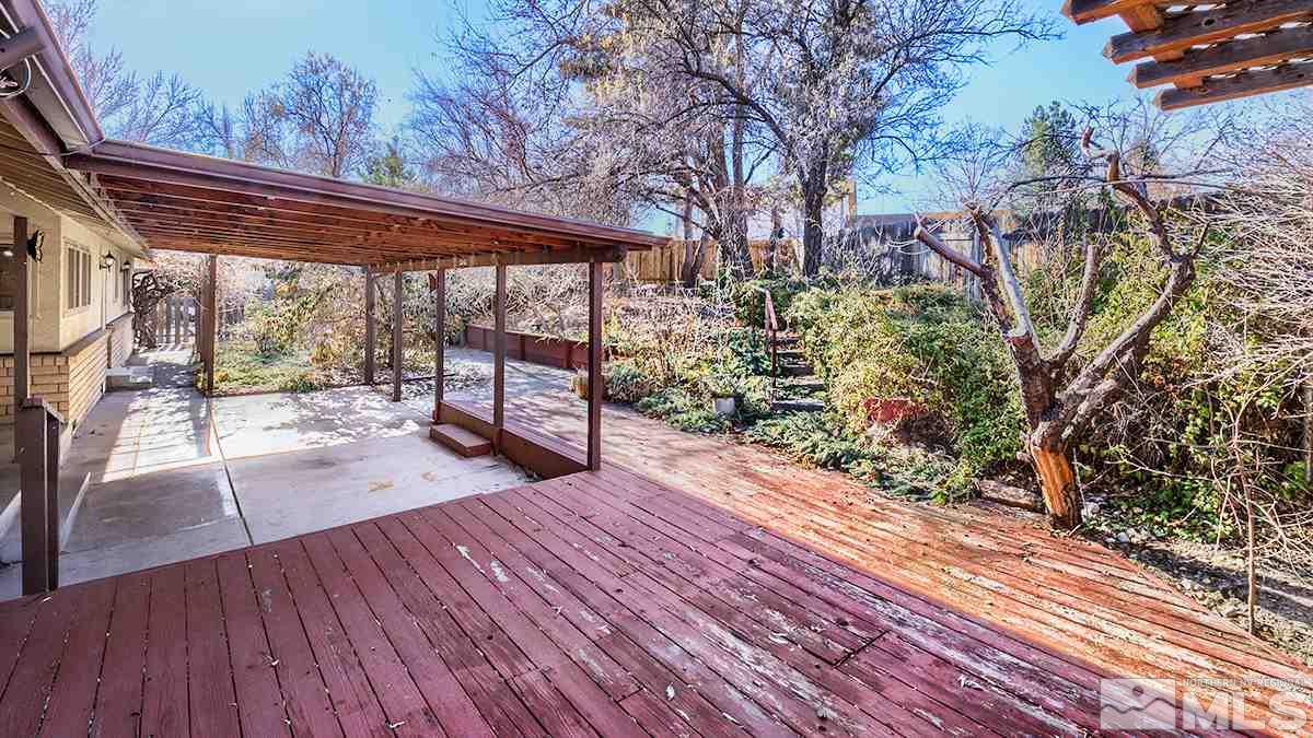 11040 Broken Hill Road Reno, NV 89511 - Photo 23 of 24 a view of backyard with a deck and wooden floor