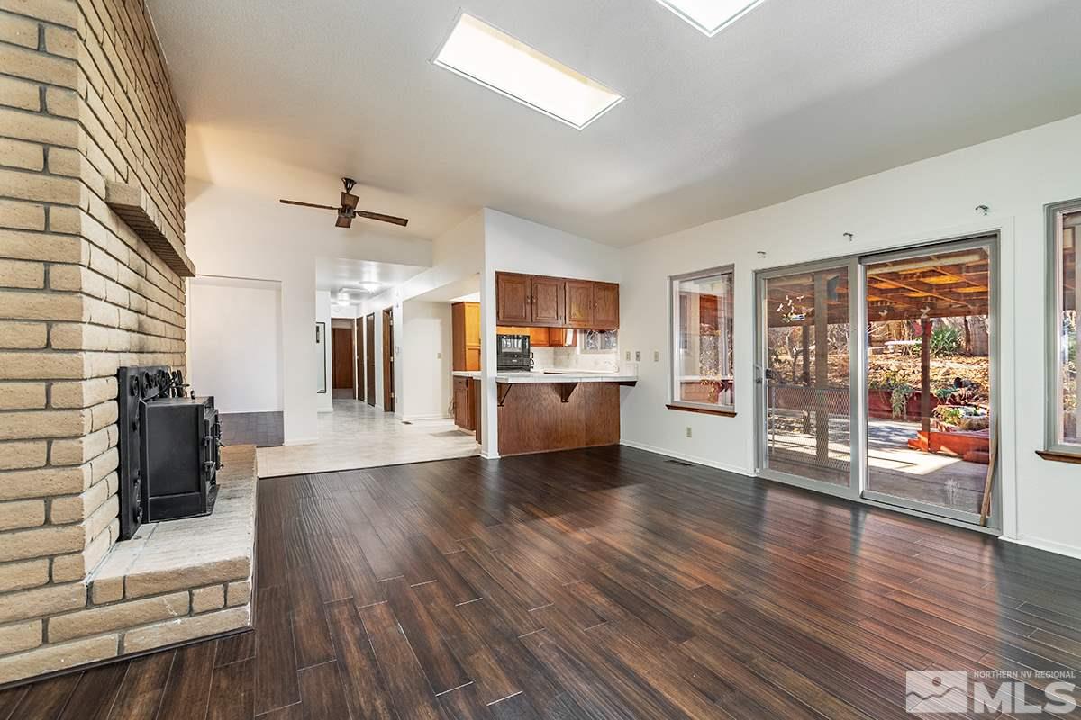 11040 Broken Hill Road Reno, NV 89511 - Photo 7 of 24 a view of a living room kitchen with furniture and wooden floor