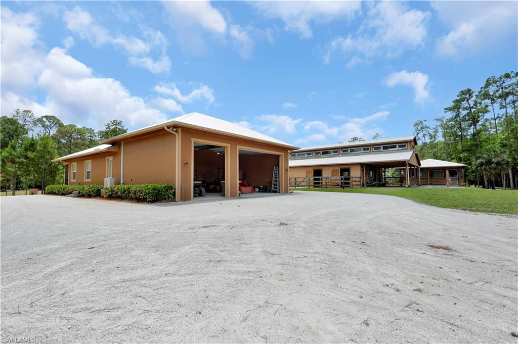 215 Auto Ranch Road Naples, FL 34114 - Photo 12 of 21 a front view of house with yard