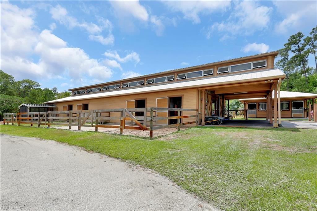 215 Auto Ranch Road Naples, FL 34114 - Photo 14 of 21 a view of a house with sitting area and garden