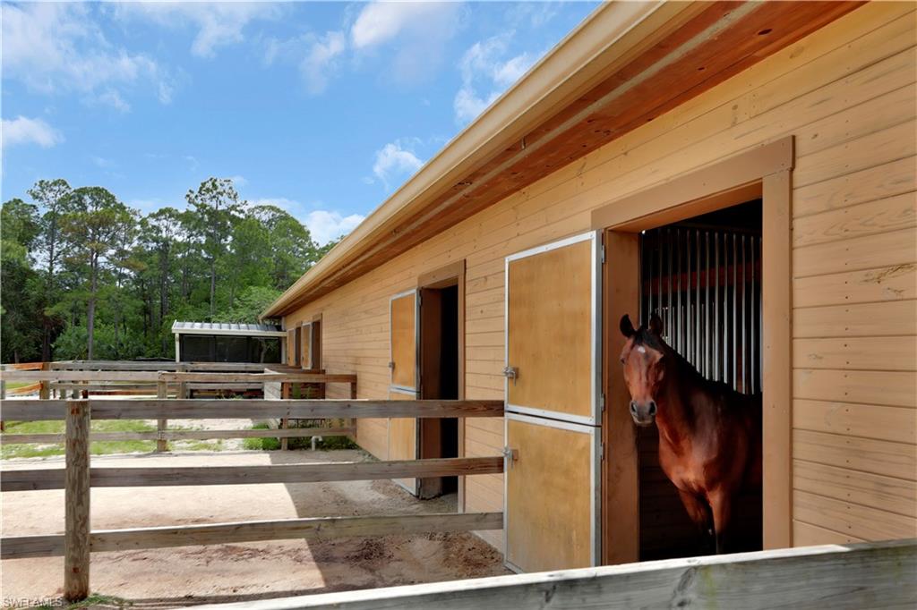 215 Auto Ranch Road Naples, FL 34114 - Photo 15 of 21 a view of a backyard with sitting area