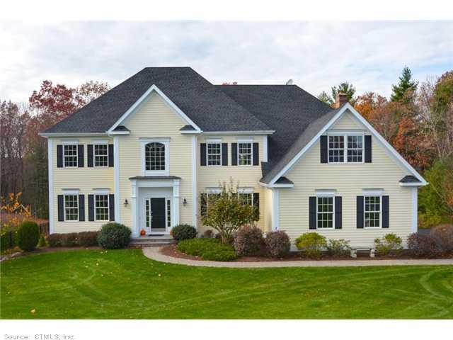 40 Pheasant Hill Road Canton, CT 06019 - Photo 1 of 1 a front view of a house with a yard