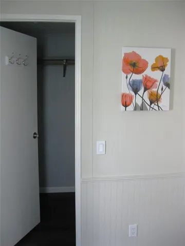 view of a room with baby toys and wooden floor