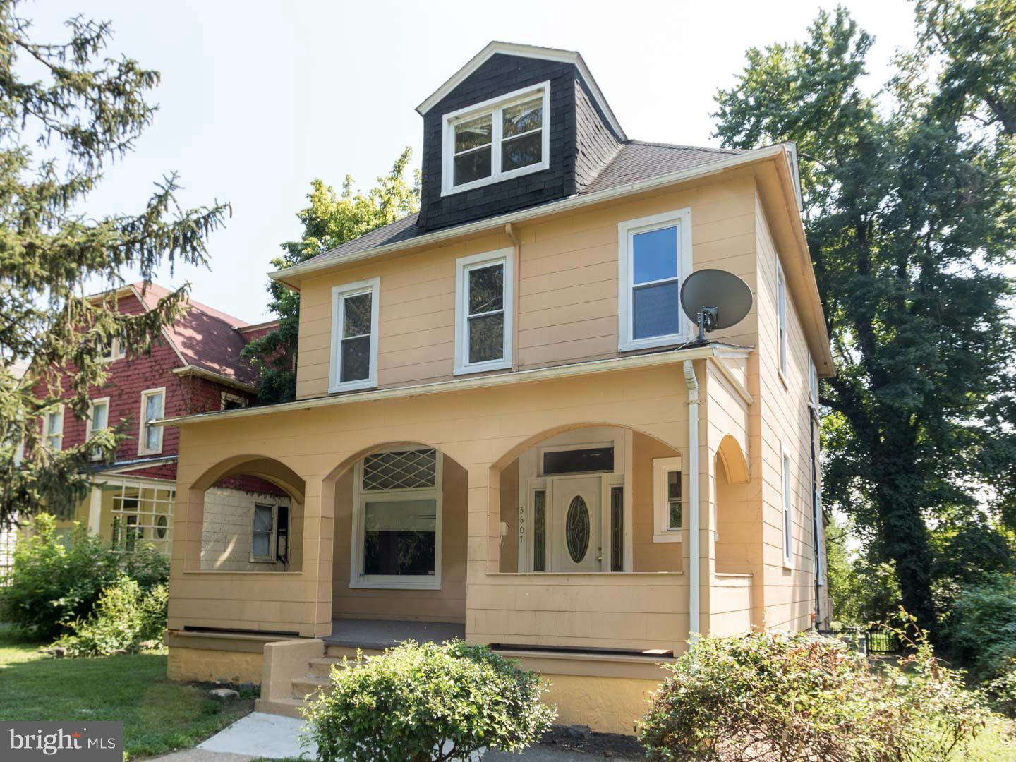 3607 Windsor Mill Road Baltimore, MD 21216 - Photo 1 of 25 a front view of a house with a garden