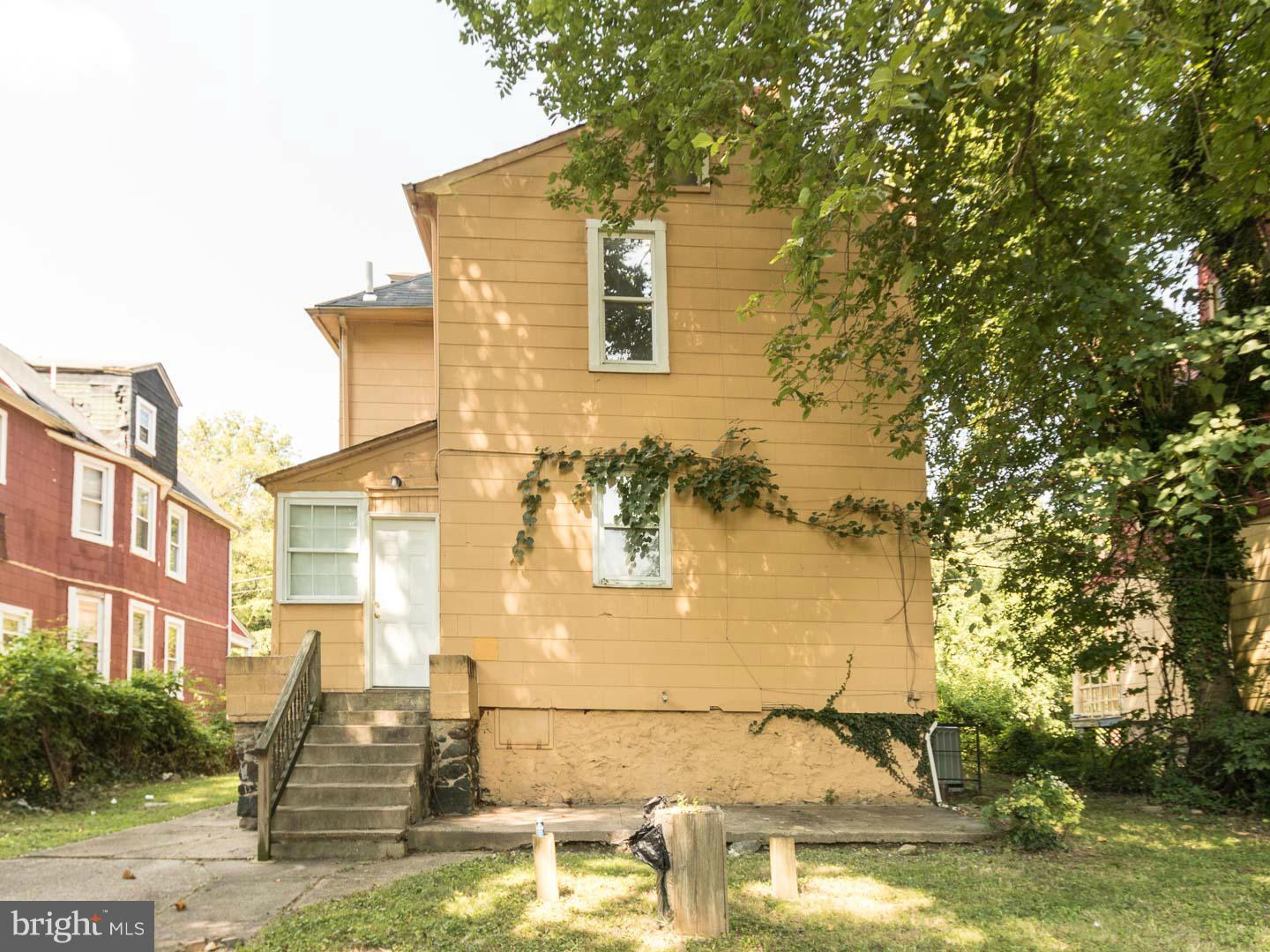 3607 Windsor Mill Road Baltimore, MD 21216 - Photo 2 of 25 a front view of a house with a yard
