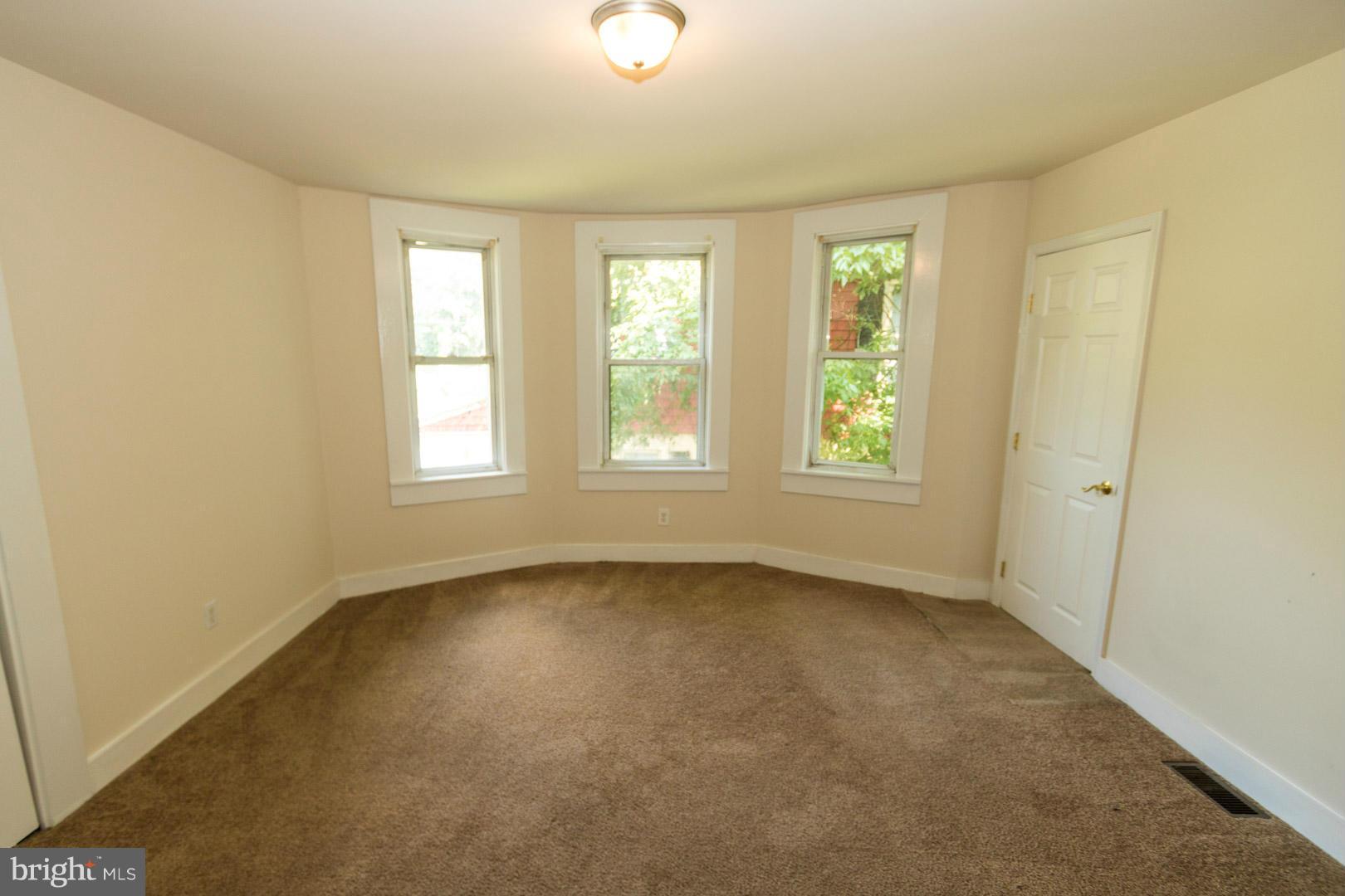 3607 Windsor Mill Road Baltimore, MD 21216 - Photo 12 of 25 a view of an empty room with a window