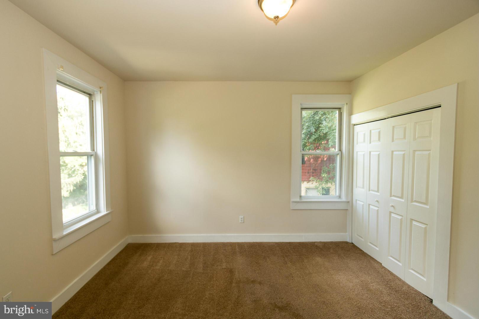 3607 Windsor Mill Road Baltimore, MD 21216 - Photo 13 of 25 an empty room with windows