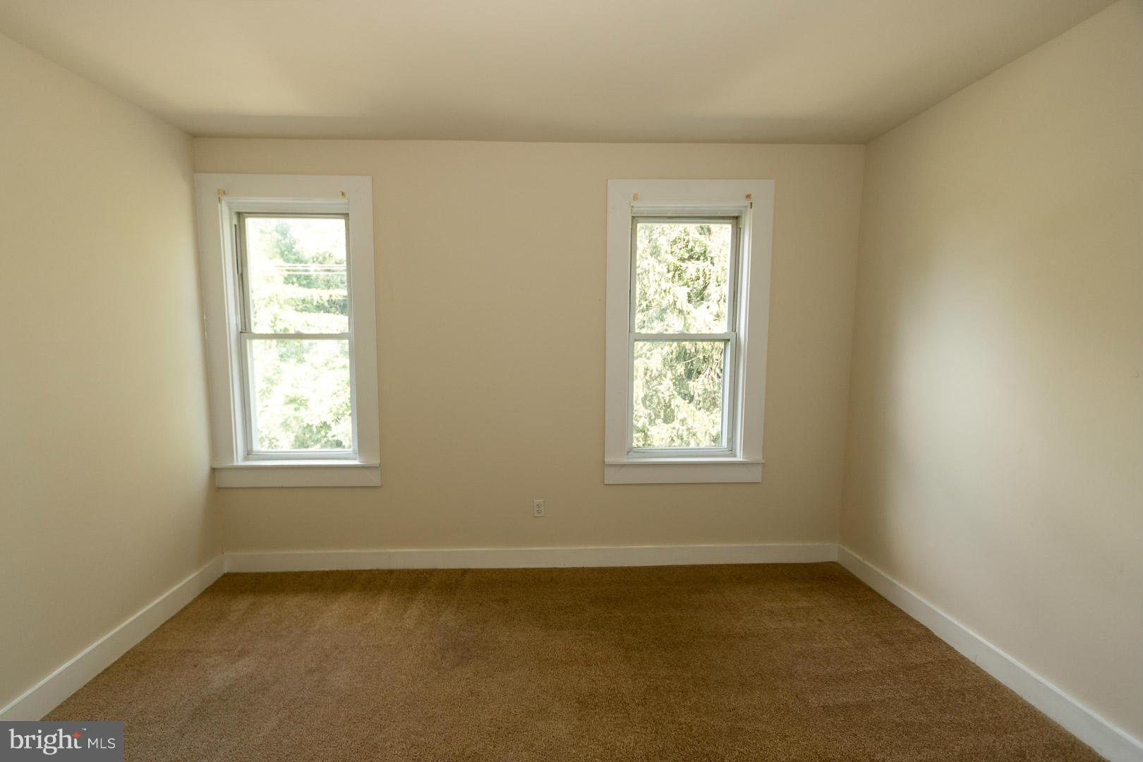 3607 Windsor Mill Road Baltimore, MD 21216 - Photo 14 of 25 an empty room with a window