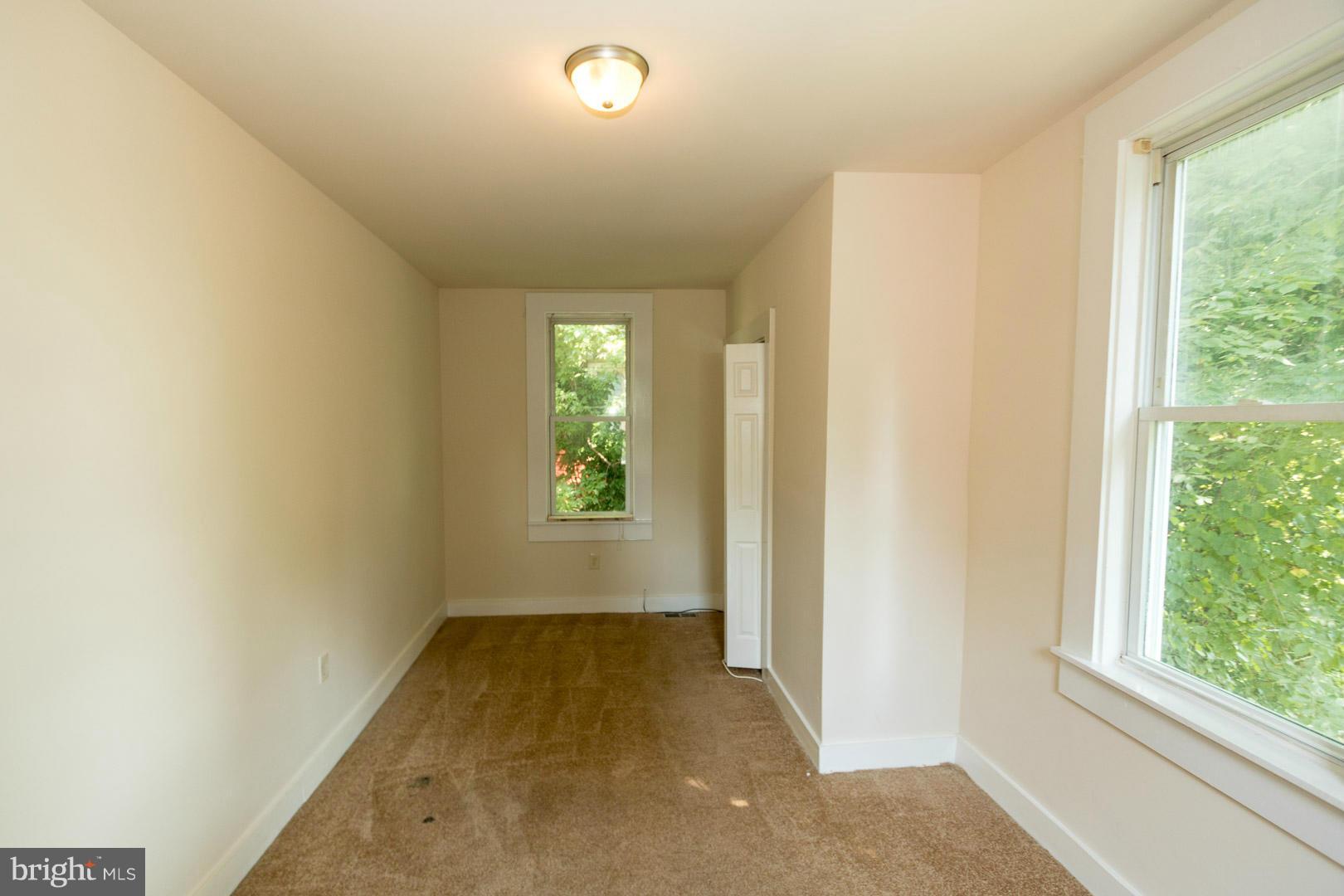 3607 Windsor Mill Road Baltimore, MD 21216 - Photo 15 of 25 an empty room with windows