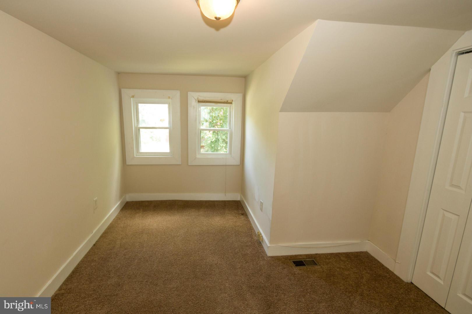 3607 Windsor Mill Road Baltimore, MD 21216 - Photo 18 of 25 an empty room with windows