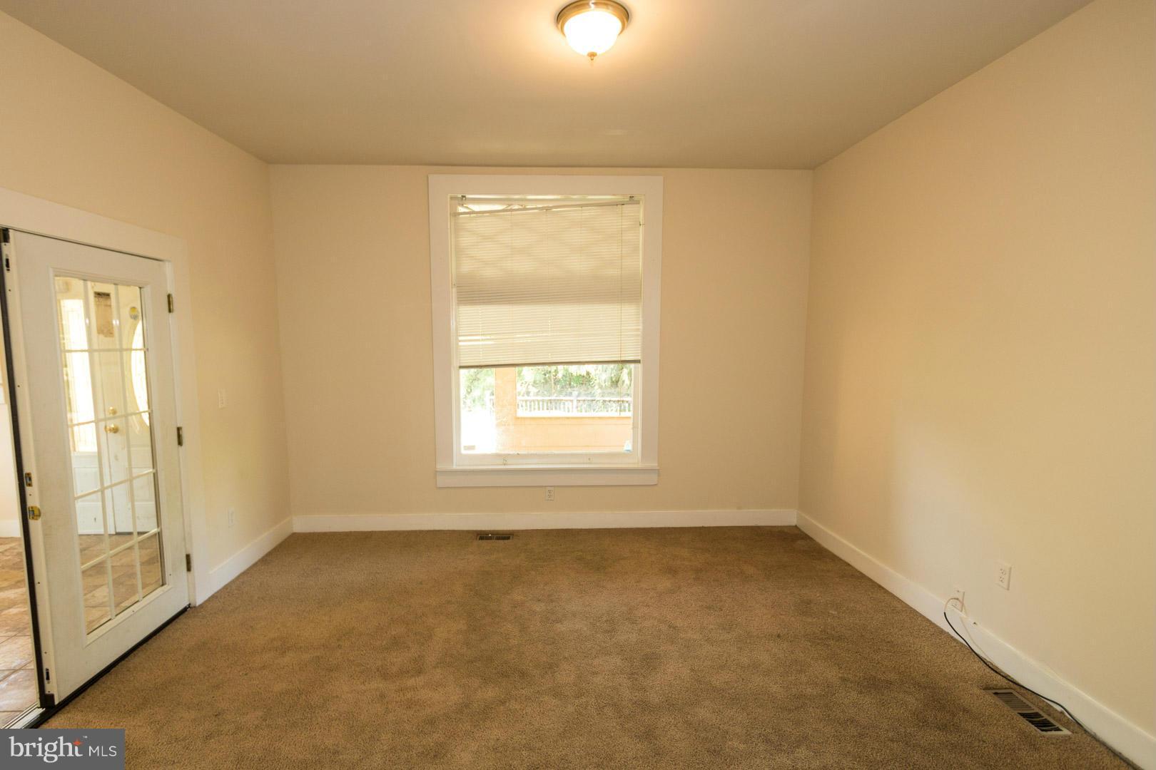 3607 Windsor Mill Road Baltimore, MD 21216 - Photo 5 of 25 en empty room with windows