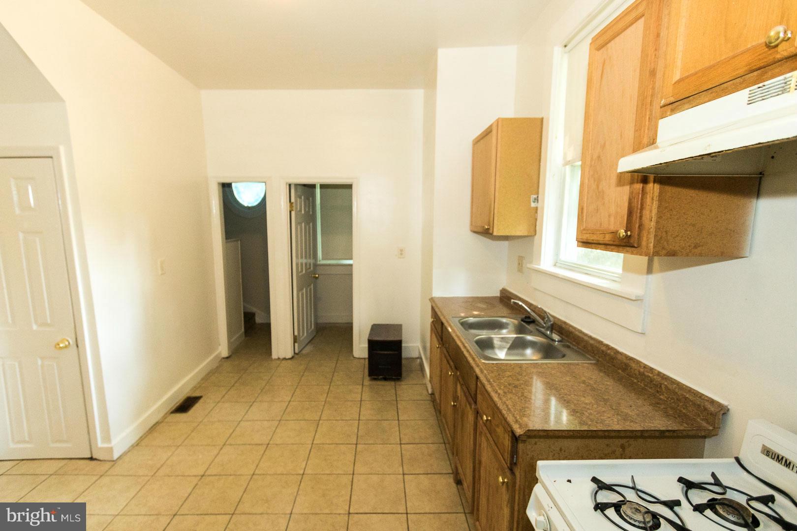 3607 Windsor Mill Road Baltimore, MD 21216 - Photo 7 of 25 a room with storage and utility