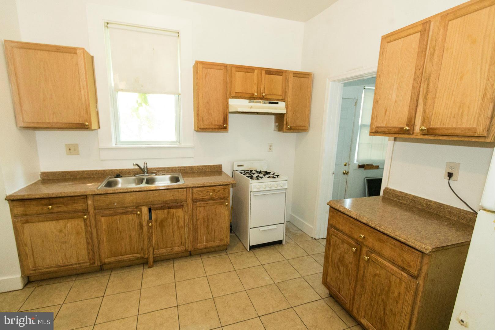 3607 Windsor Mill Road Baltimore, MD 21216 - Photo 8 of 25 a utility room with a sink washer and dryer