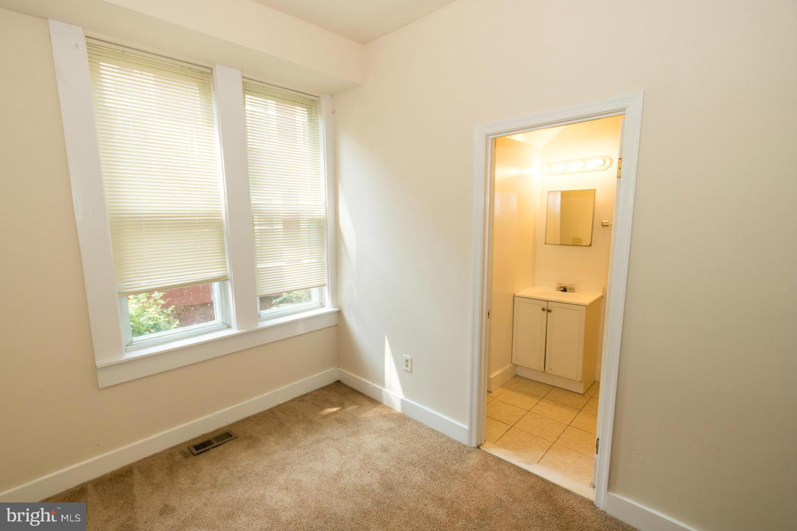 3607 Windsor Mill Road Baltimore, MD 21216 - Photo 9 of 25 a view of an empty room with a window