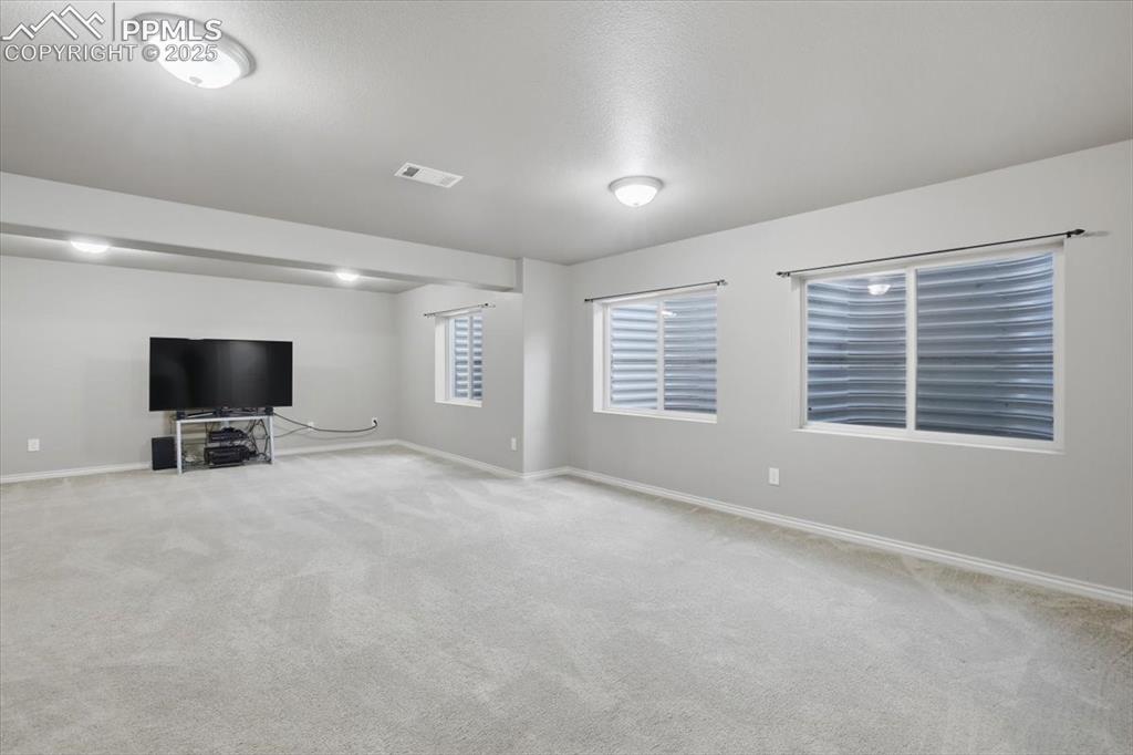 2374 Cinnabar Road Colorado Springs, CO 80921 - Photo 42 of 47 The basement level family room gets lots of natural light from the large windows.