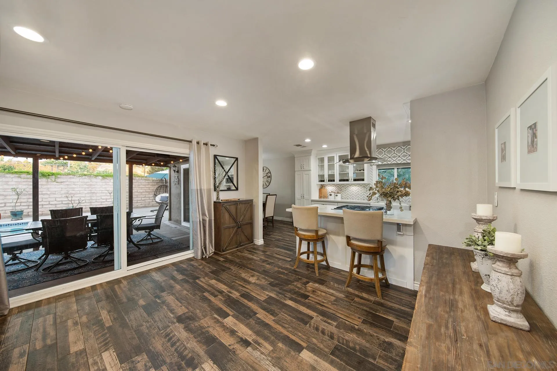 14161 Halper Road Poway, CA 92064 - Photo 30 of 64 a view of a dining room with furniture window and wooden floor