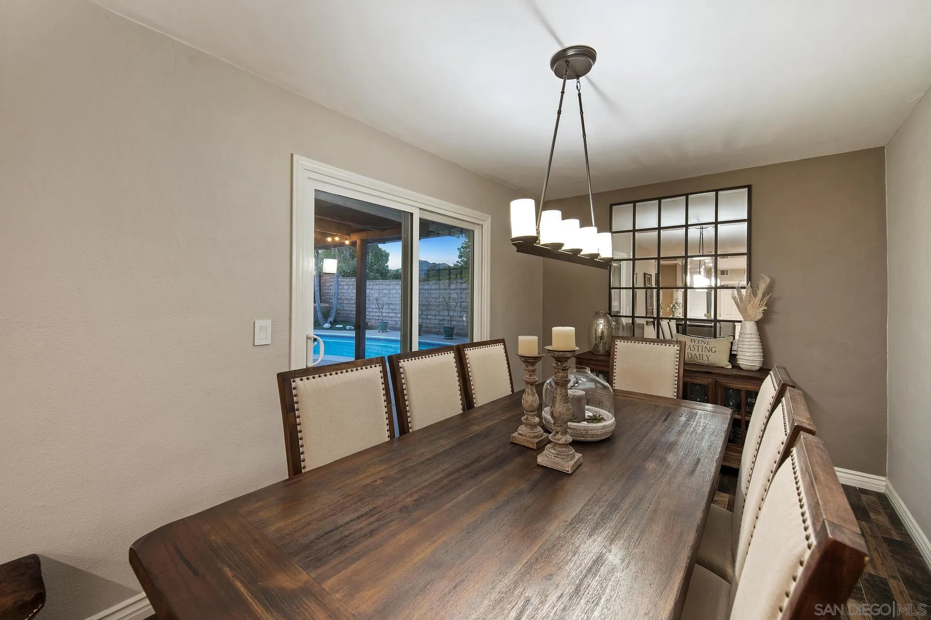 14161 Halper Road Poway, CA 92064 - Photo 33 of 64 a dining room with furniture a chandelier and wooden floor