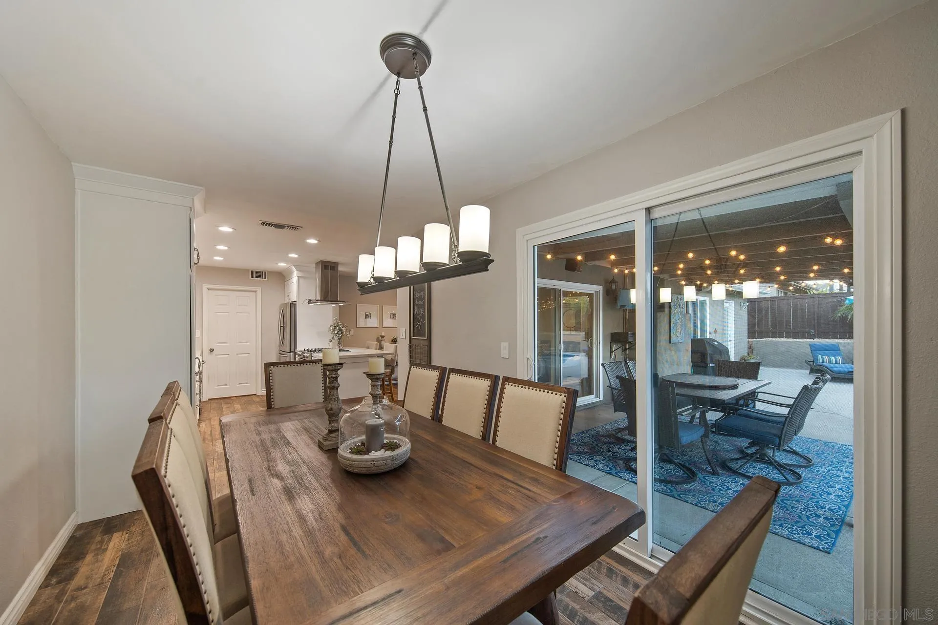 14161 Halper Road Poway, CA 92064 - Photo 35 of 64 a view of a dining room with furniture wooden floor and chandelier
