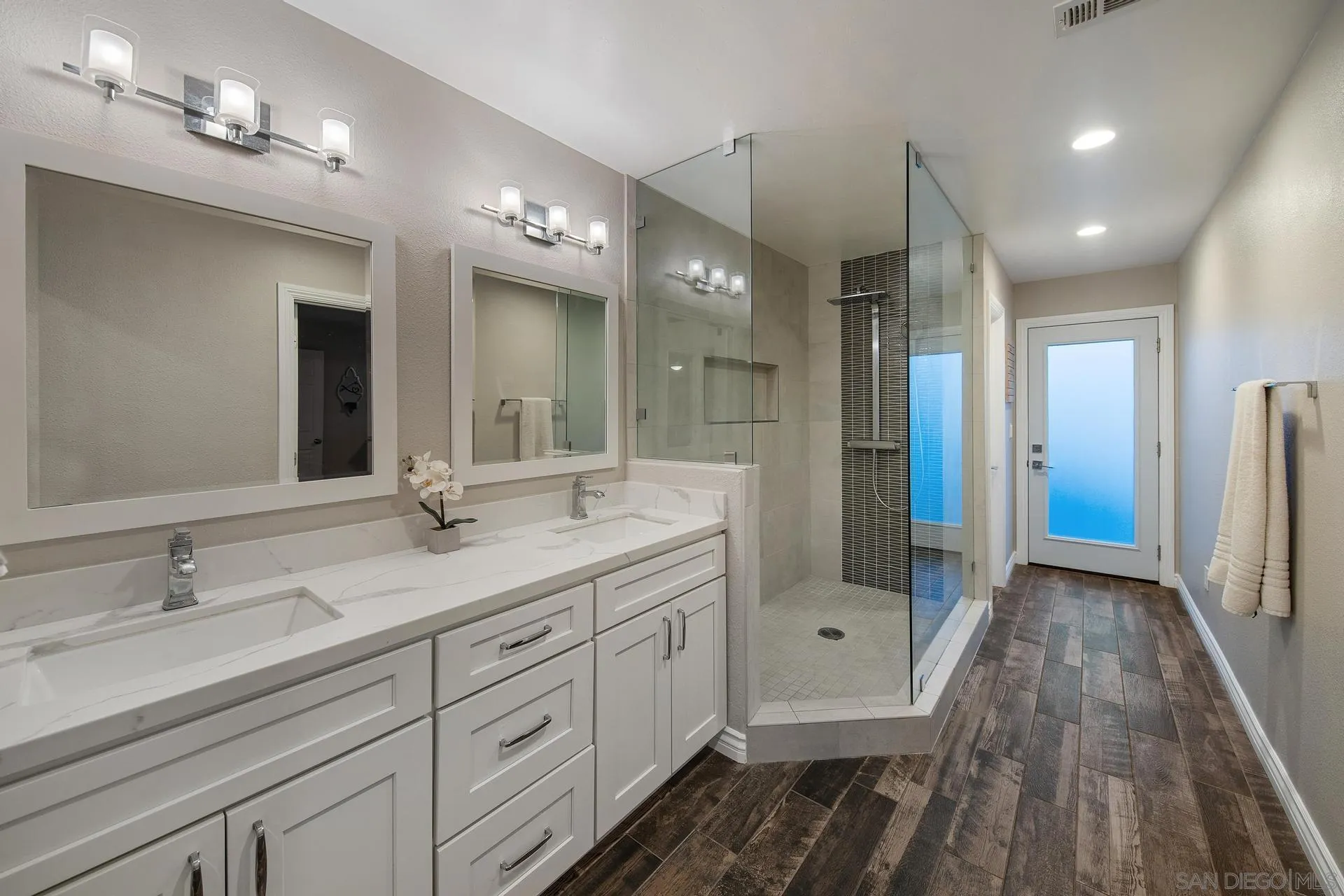 14161 Halper Road Poway, CA 92064 - Photo 40 of 64 a bathroom with a double vanity sink and a mirror