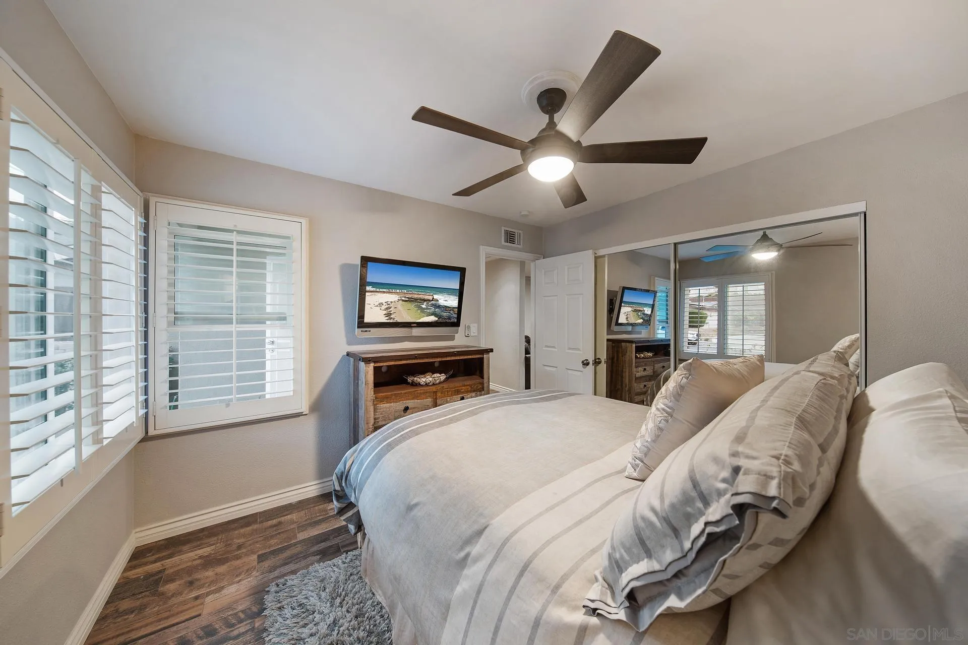 14161 Halper Road Poway, CA 92064 - Photo 49 of 64 a bedroom with a bed and a flat screen tv