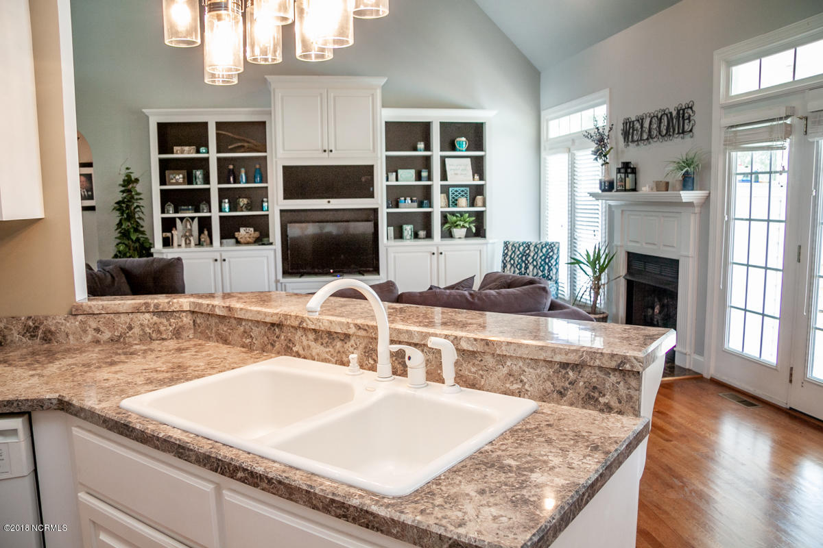 8642 Bailey Road Sims, NC 27880 - Photo 20 of 40 VIEW FROM KITCHEN TO GREAT ROOM W/ BUILT-INS