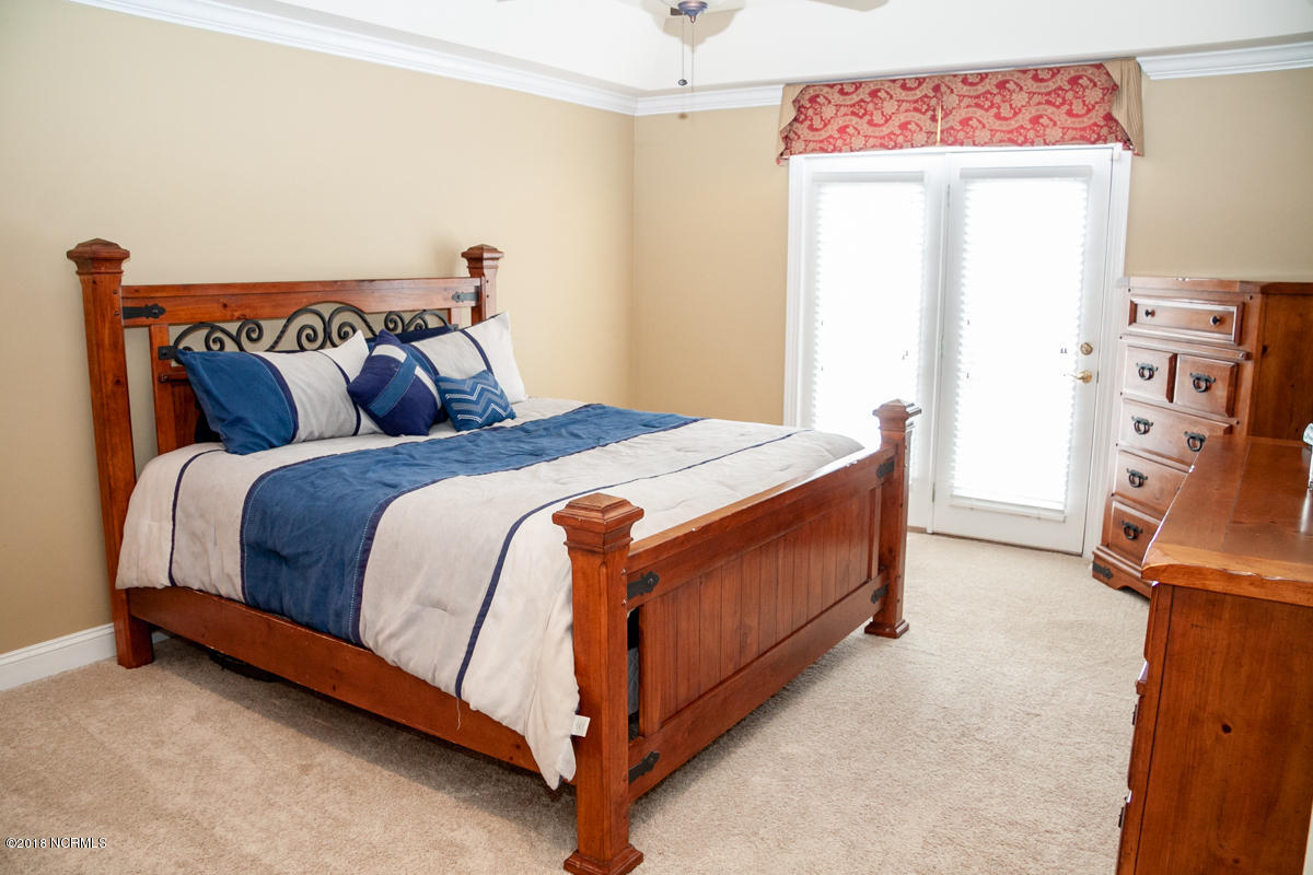 8642 Bailey Road Sims, NC 27880 - Photo 23 of 40 SPACIOUS MASTER SUITE W/ SEPARATE DOOR TO THE PATIO & POOL
