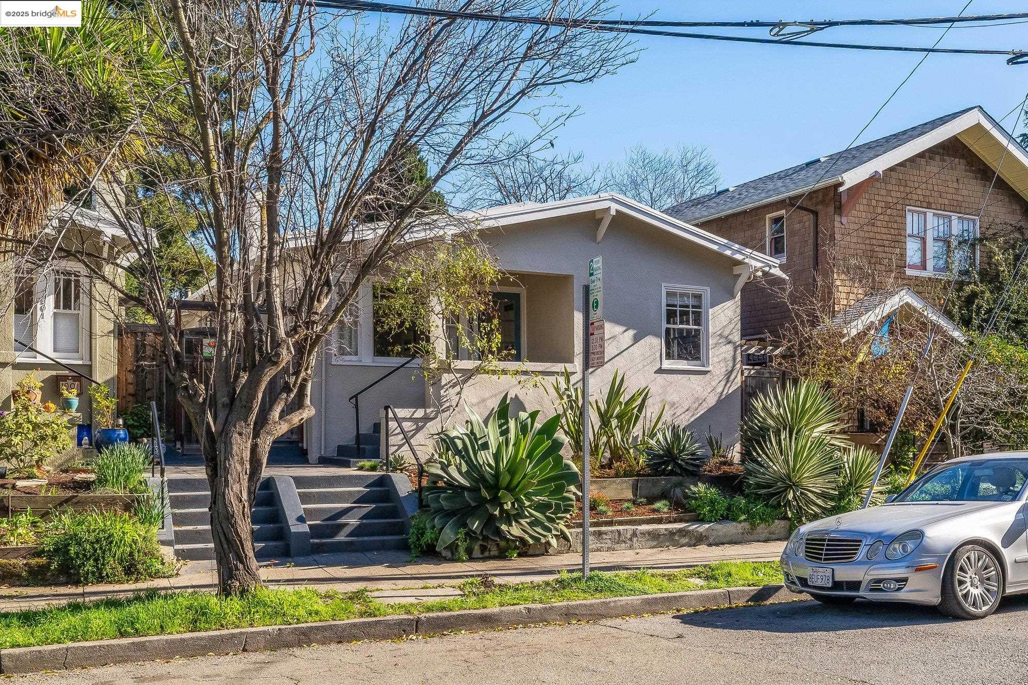 a view of a car parked in front of a house