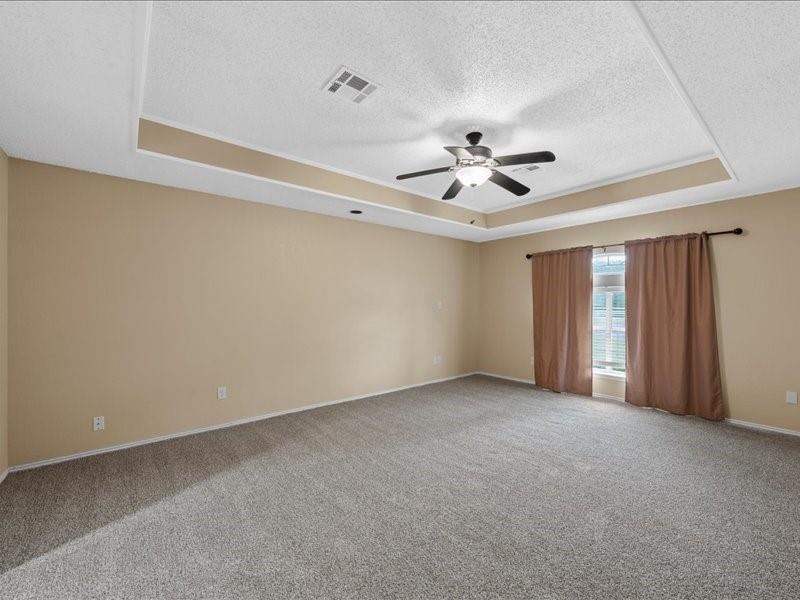 1072 Chapman Road Crawford, TX 76638 - Photo 16 of 39 a view of an empty room with a ceiling fan
