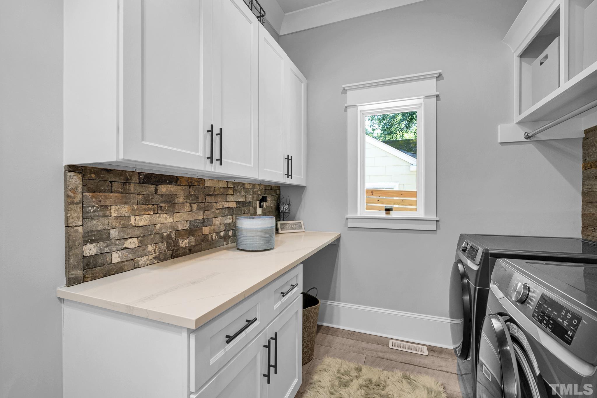 903 North State Street Raleigh, NC 27604 - Photo 26 of 56 a kitchen with white cabinets and window
