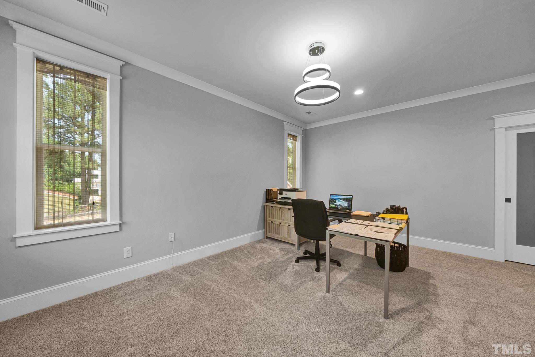903 North State Street Raleigh, NC 27604 - Photo 50 of 56 a view of a workspace with furniture and a window