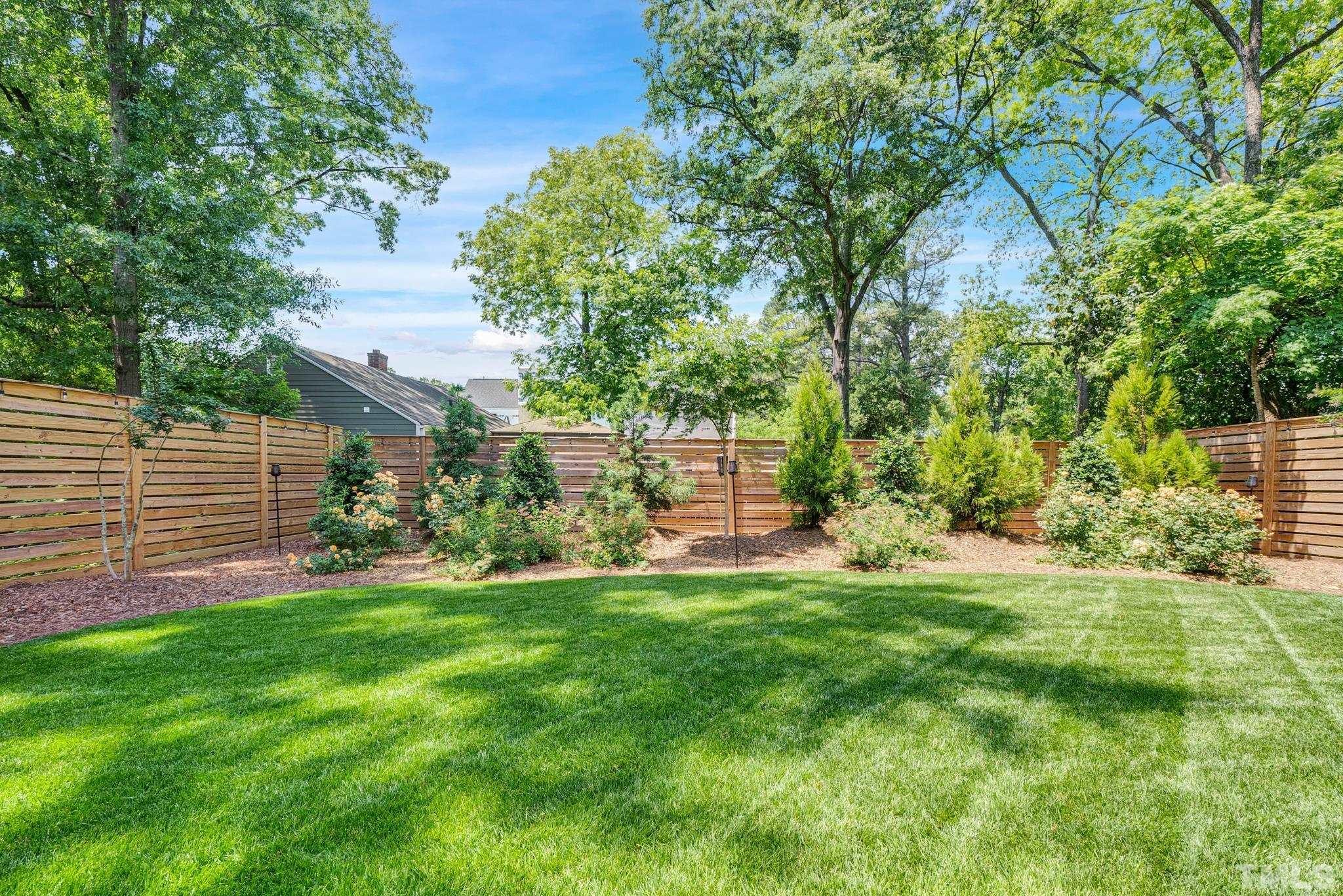 903 North State Street Raleigh, NC 27604 - Photo 5 of 56 a view of a backyard with a small cabin