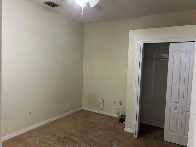 an empty room with a bathroom