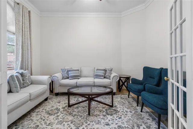 a living room with furniture and a rug