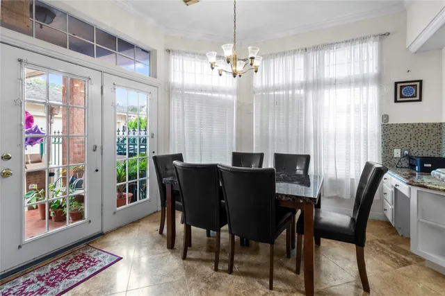 a view of a dining room with furniture and a window