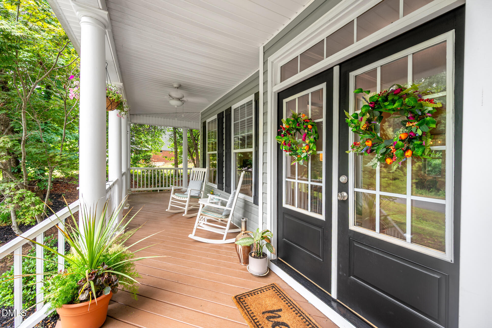 726 Ruth Circle Fuquay-Varina, NC 27526 - Photo 4 of 61 a view of a porch with chairs and potted plants
