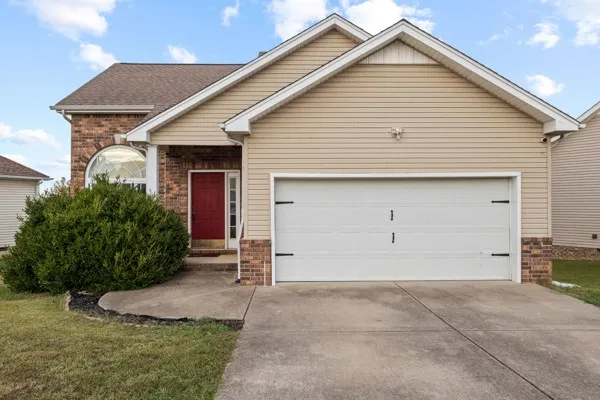 a view of house with garage