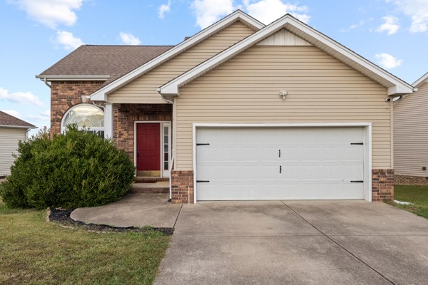 a view of house with garage
