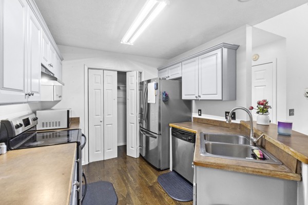 500 Berry Circle Springfield, TN 37172 - Photo 11 of 27 a kitchen with stainless steel appliances granite countertop a refrigerator sink and stove