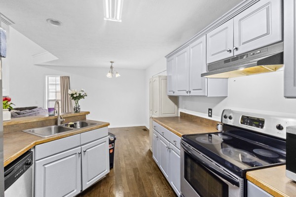 500 Berry Circle Springfield, TN 37172 - Photo 12 of 27 a kitchen with stainless steel appliances granite countertop a sink stove and cabinets