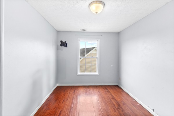 500 Berry Circle Springfield, TN 37172 - Photo 16 of 27 an empty room with wooden floor and windows