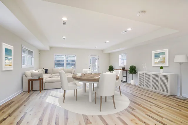 a view of a dining room with furniture window and wooden floor