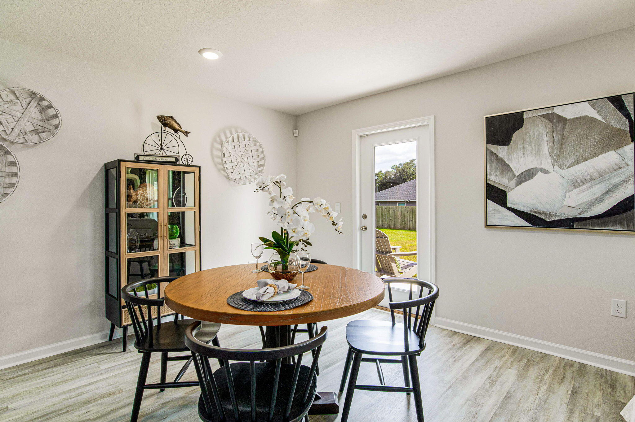 3017 Jane Lane Crestview, FL 32539 - Photo 6 of 17 a view of a dining room with furniture and wooden floor