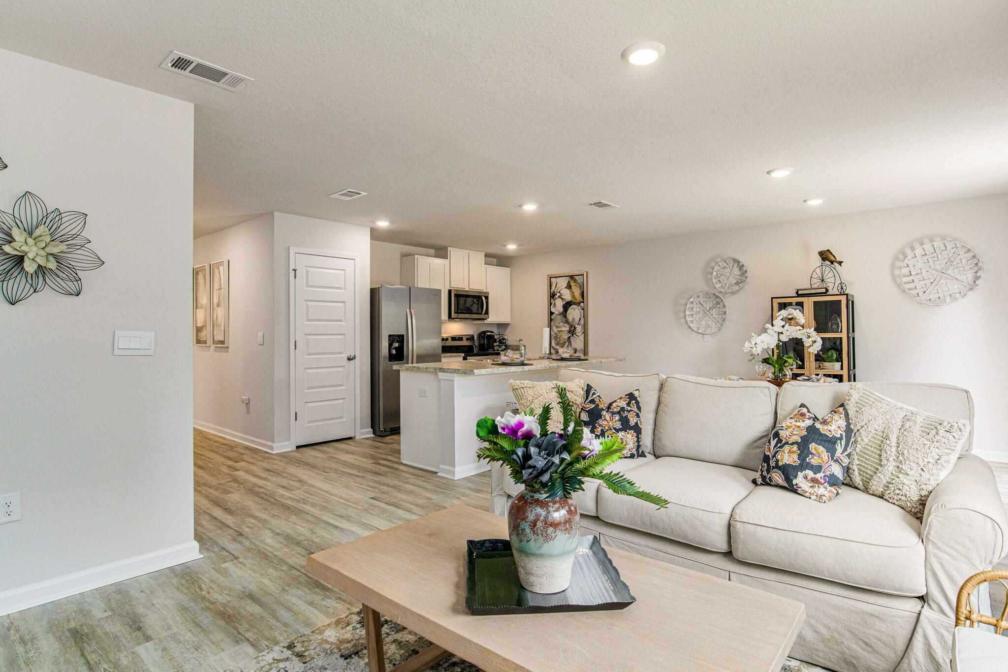 3017 Jane Lane Crestview, FL 32539 - Photo 8 of 17 a living room with furniture potted plant and kitchen view